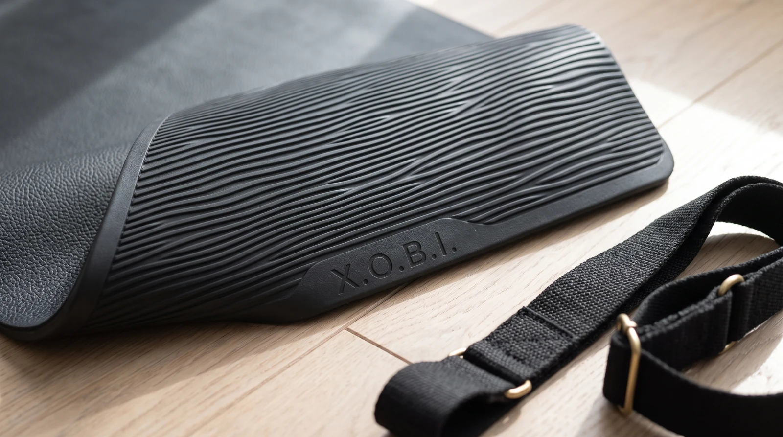 The folded mat with its strap
